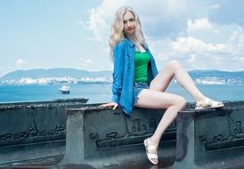 girl posing on the background of the ship