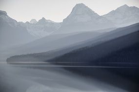 Landscape of foggy lake, glacier national park, montana
