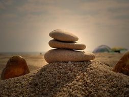 pile of pebbles on Sand at Sky