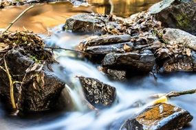 running water among stones close-up