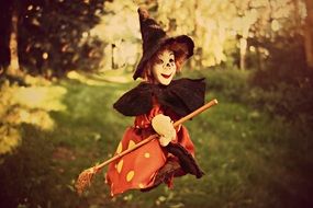 toy Witch with Broom in flight