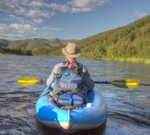 man in raft in Alaska