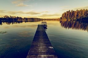 long wooden pier on a lake in poland