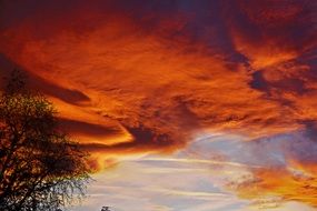 red and blue sky over the countryside
