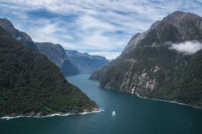 panoramic view of the lake among the high mountains on a cloudy day