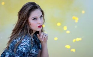 young woman posing by the lake