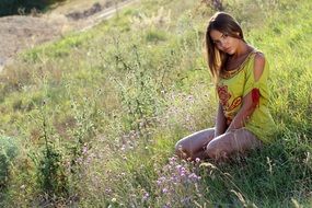 seductive girl on the grass