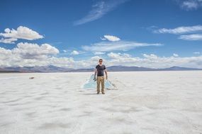 man at the salt marshes in argentina on a sunny day