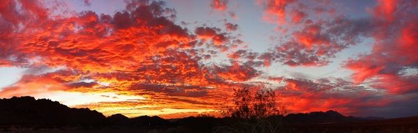 fiery clouds over the dark mountains
