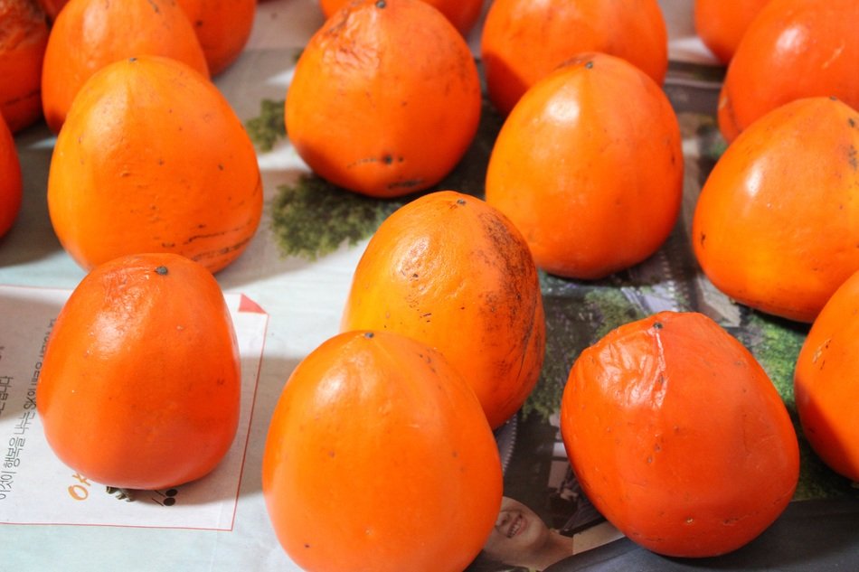 ripe persimmon on the table
