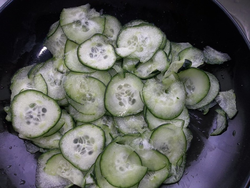cucumber salad in a purple bowl