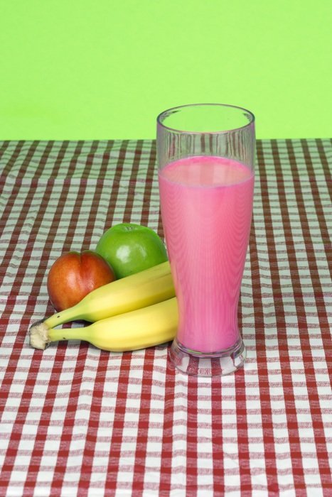pink milkshake and fruit on the table