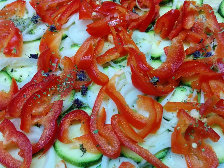 surface of raw Pizza with Zucchini and Peppers
