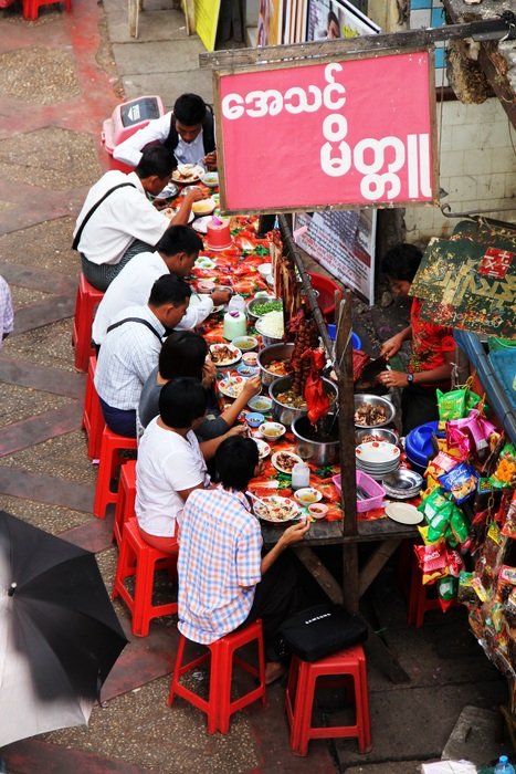 Humans eat food on the street
