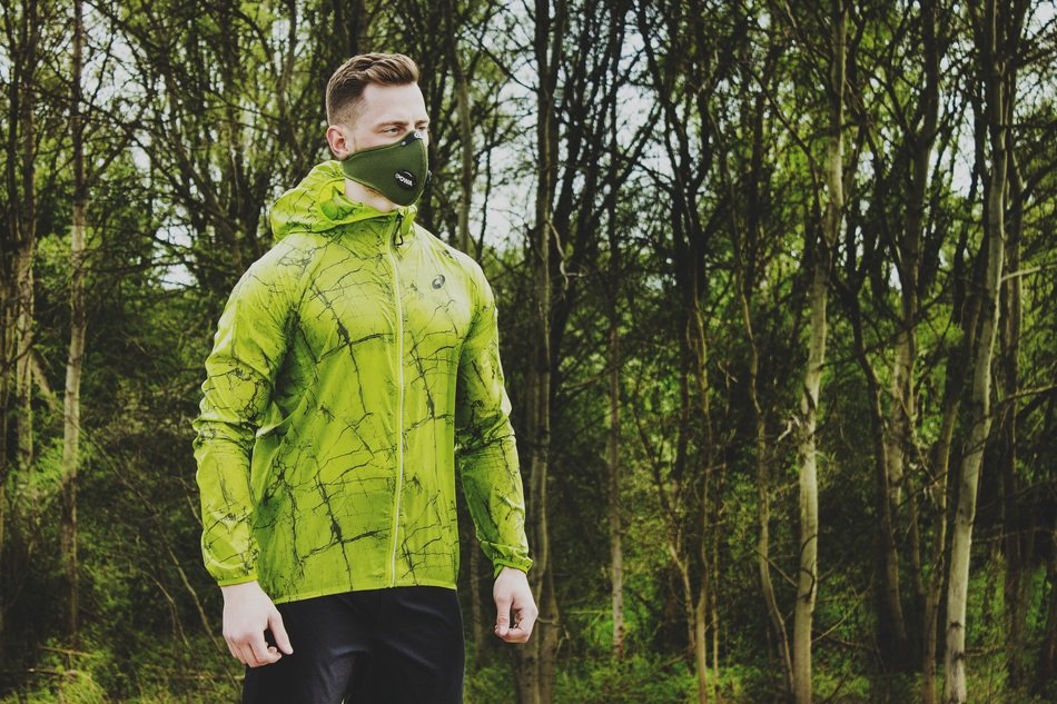man in mask in the forest