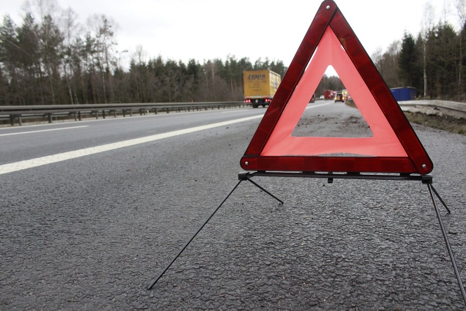 emergency sign on asphalt close up