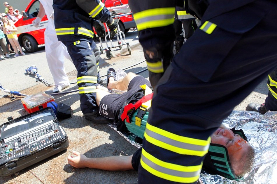 First aid for affected human on a road