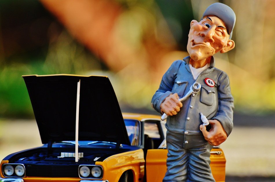 figure of the master near the model cars