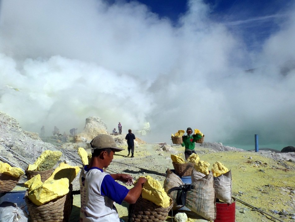 miners near the crater in indonesia