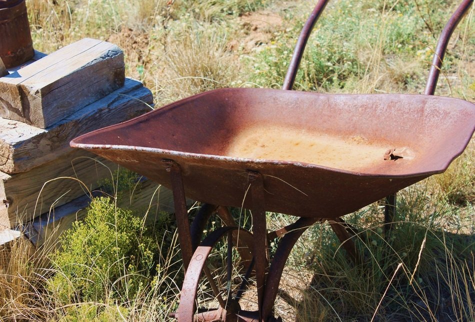 old wheelbarrow under the bright sun
