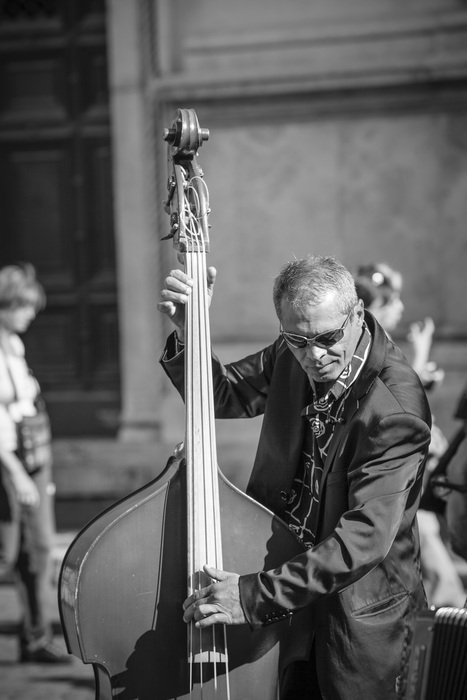 black and white image of street musicians in rome