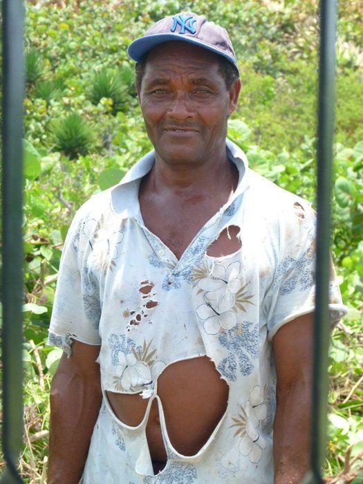 worker in torn clothes in jamaica