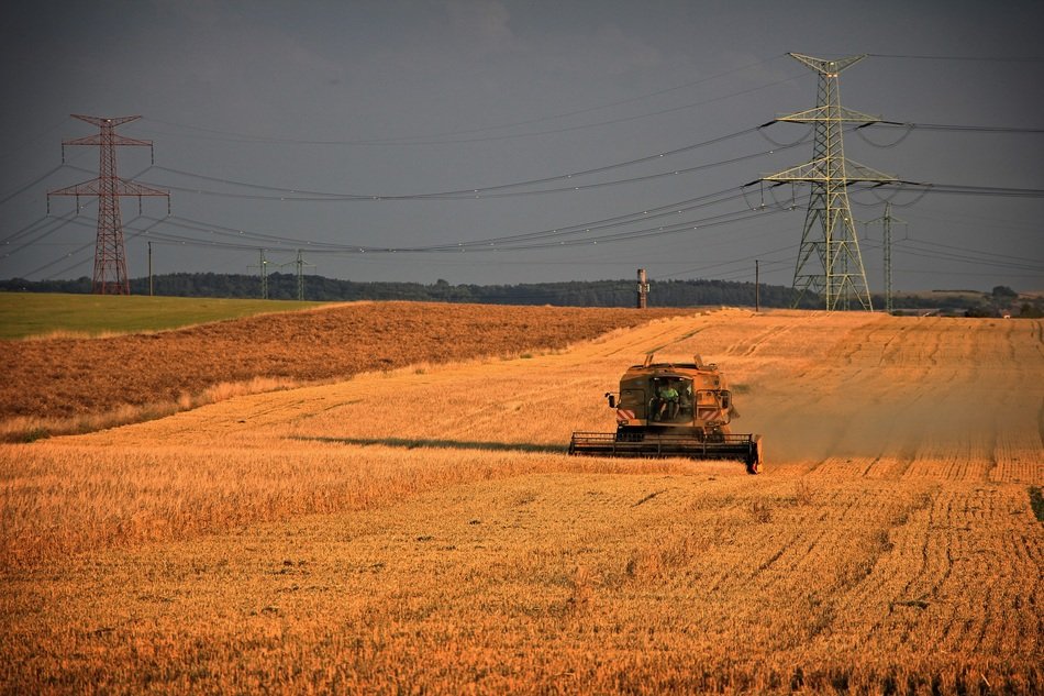 distant view of the combine on the field