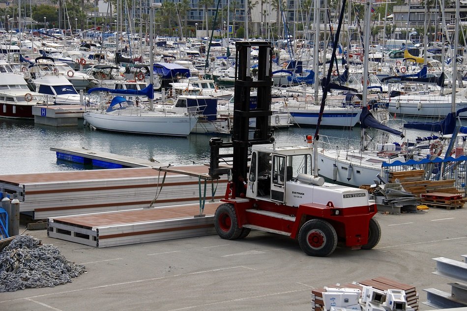 car in port near boats