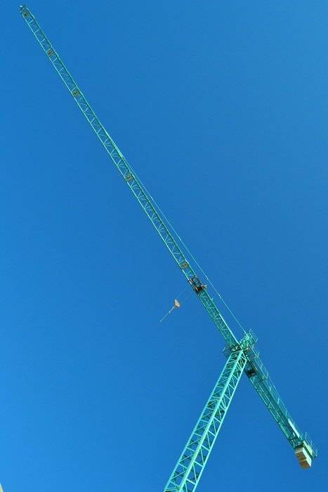 turquoise construction crane