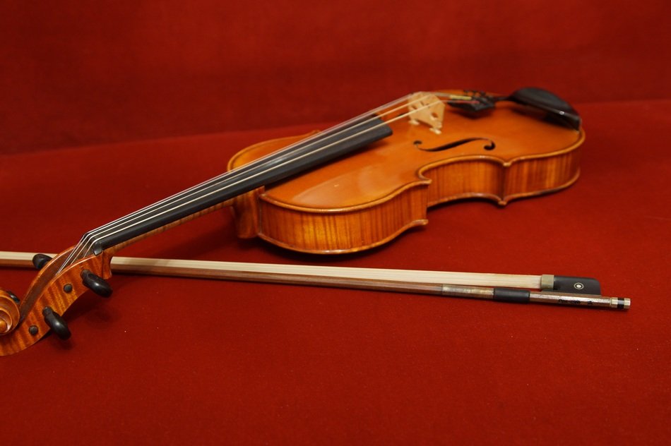 classical cello on a burgundy background