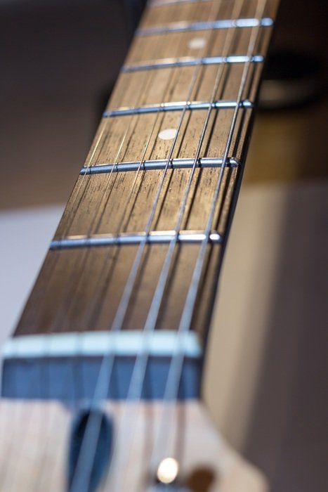 blurred strings of electric guitar