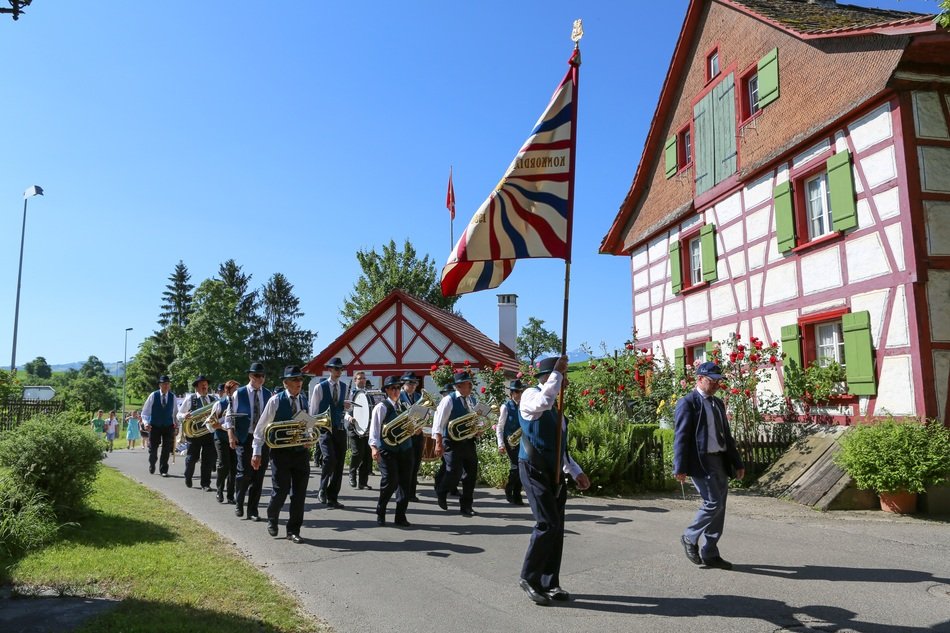 march of musicians in front of the church