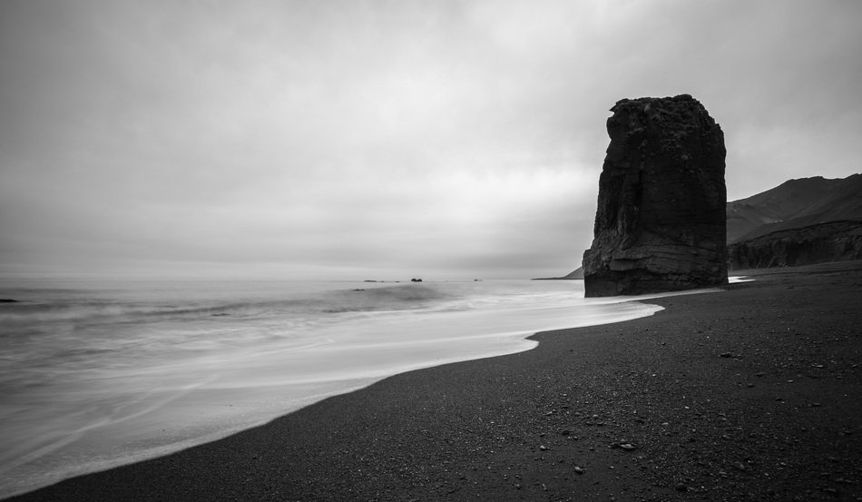 big black stone by the ocean