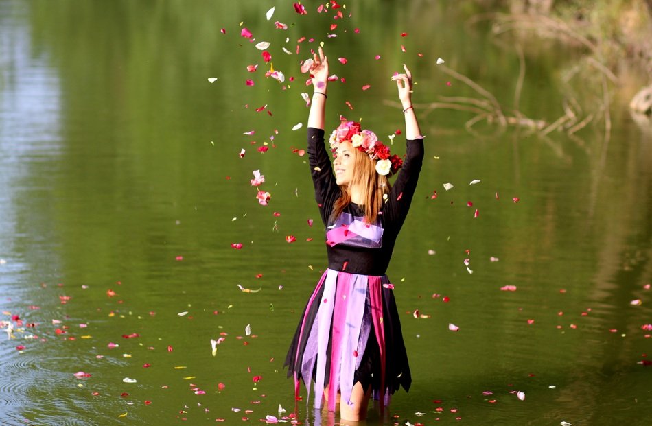 girl with flower wreath in water