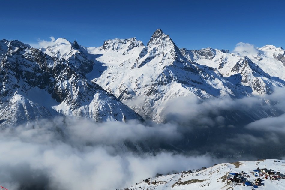 smoke over the snowy peaks of the mountains
