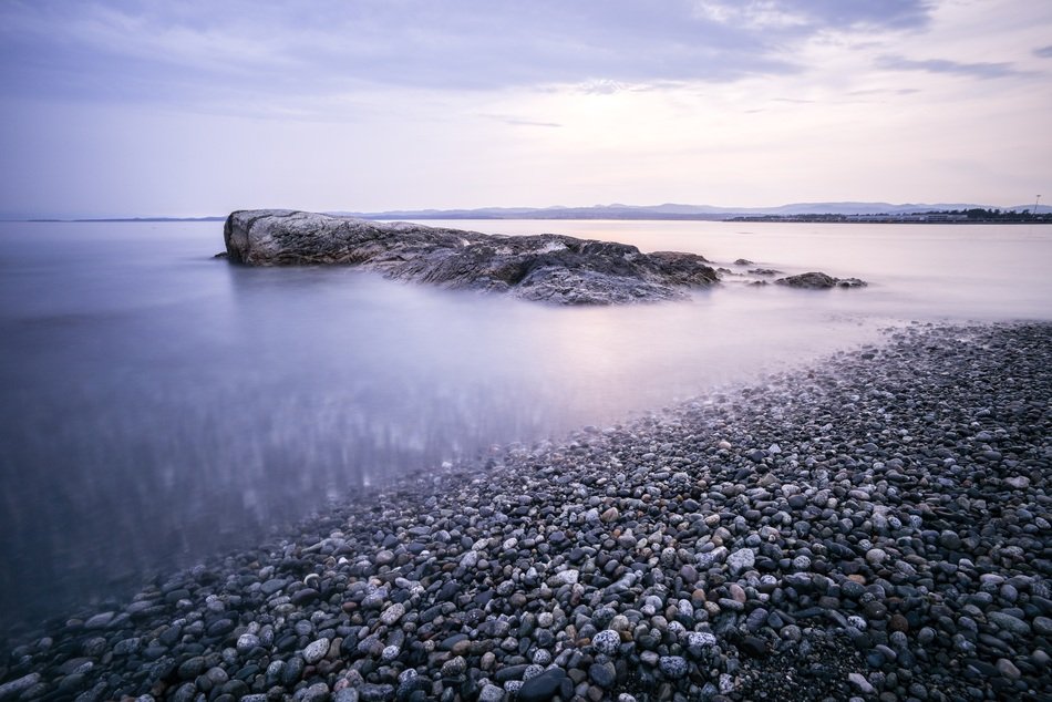 morning fog on a pebble beach