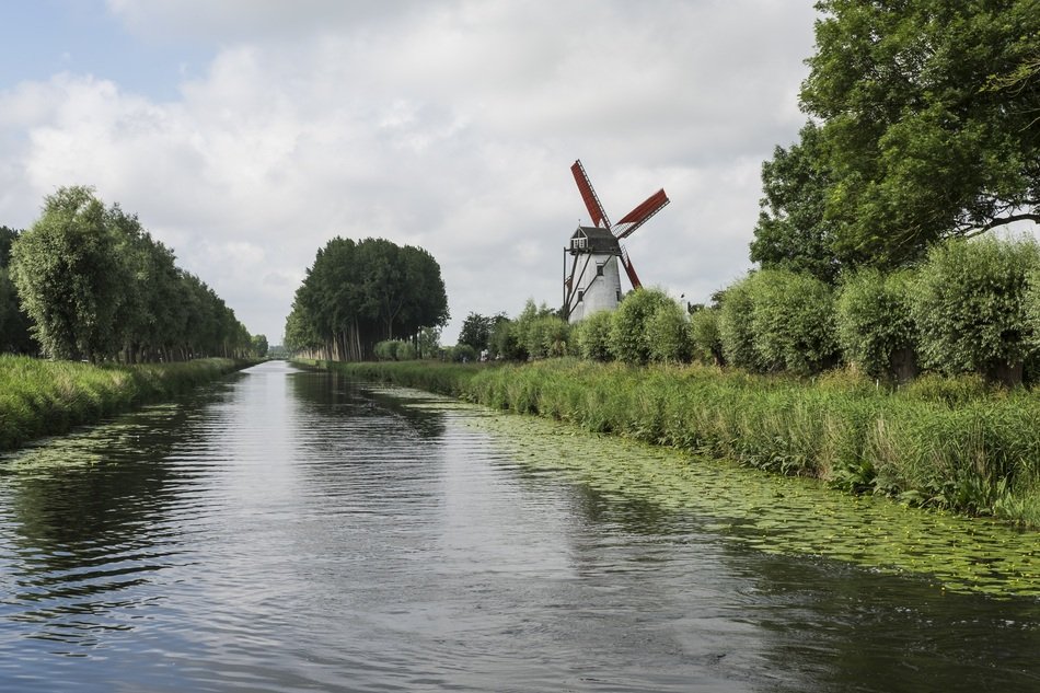 mill stands on the bank of a canal in Damme