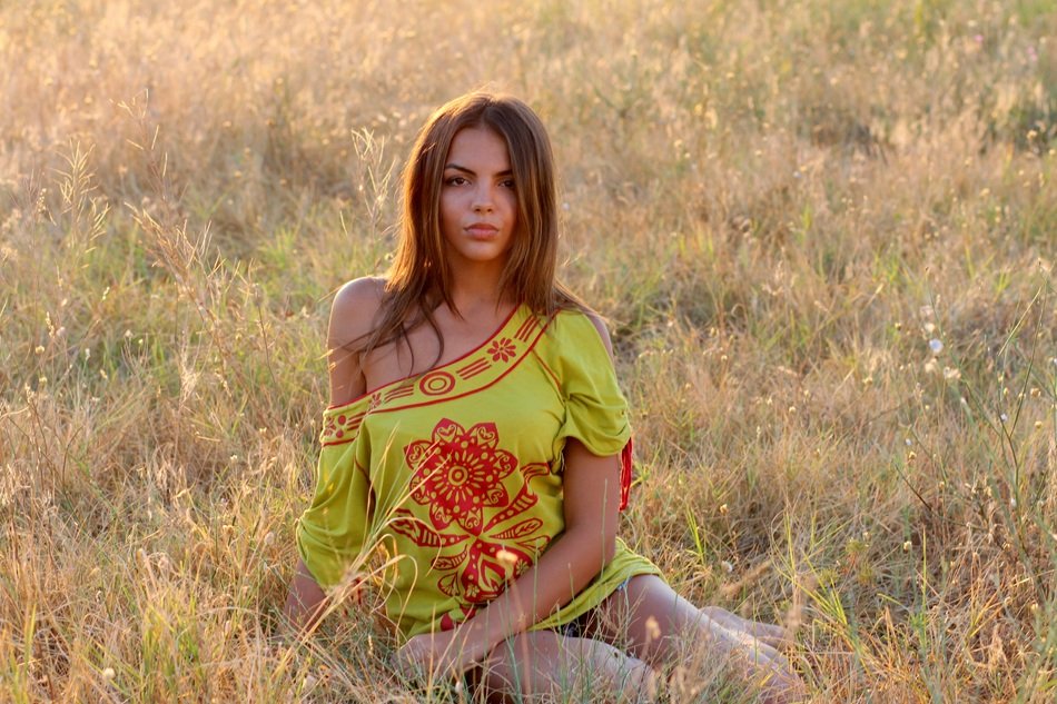 girl in the grass in the evening