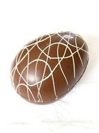 chocolate egg with white icing