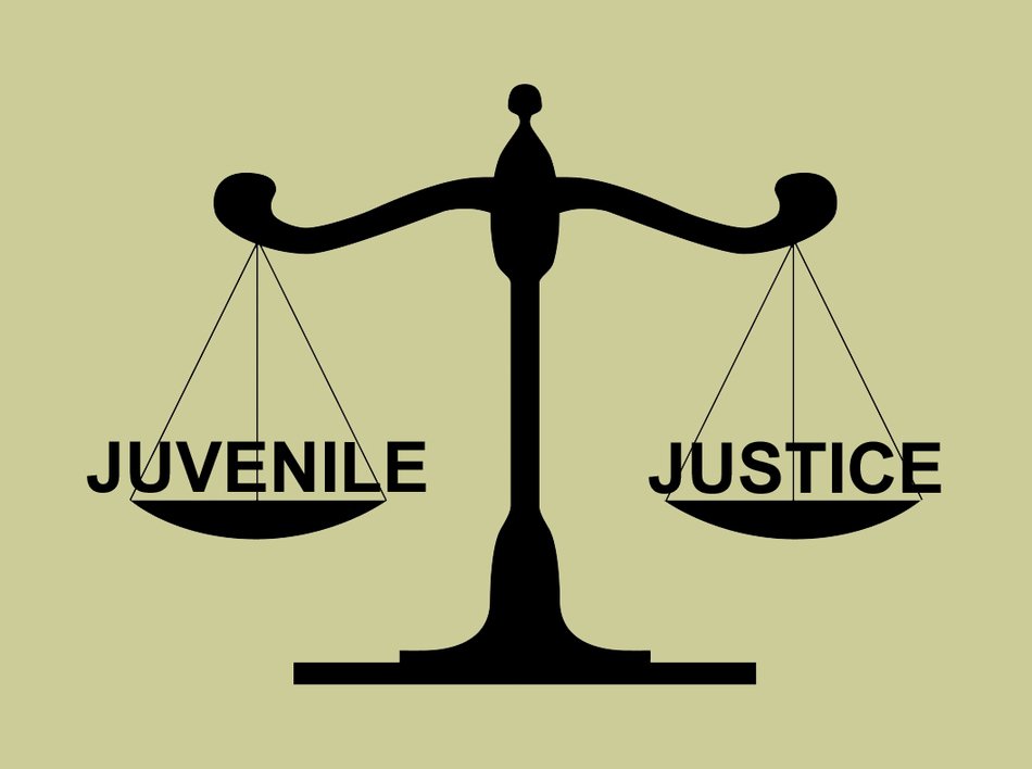 prison justice logo with scales of justice