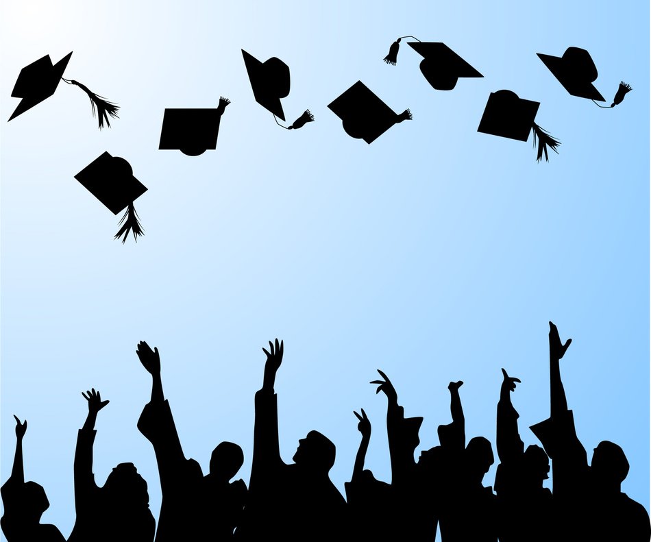 silhouettes of graduates against the blue sky