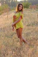 seductive girl in a yellow dress