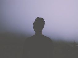 photo of a man in dense fog