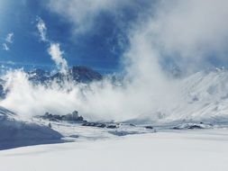 clouds on Snowy Mountains, winter Landscape