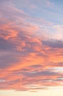 clouds with pink glow on the sky