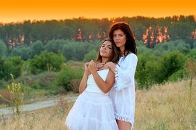 two young Girls together at Sunset