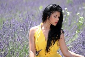 brunette in yellow dress in the lavender dress