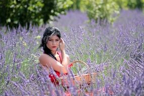 brunette woman in red dress in lavender field