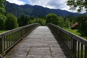 wooden foot bridge in the alps