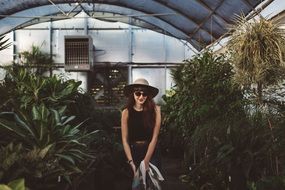 young Girl in Greenhouse scene